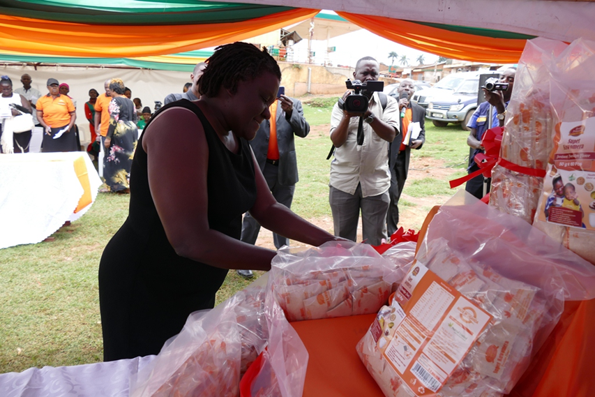 Figure 7: Ms. Sarah Ngalombi, Senior Nutritionist in the Ministry of Health, Uganda, launching the Super Kawomera product