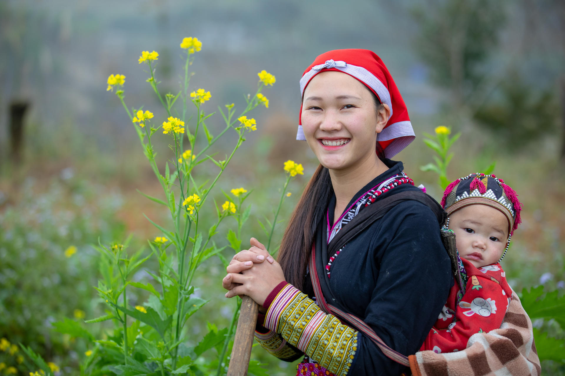 Portrait of a Dao woman and her baby, Sa Pa, Lao Cai province, Vietnam