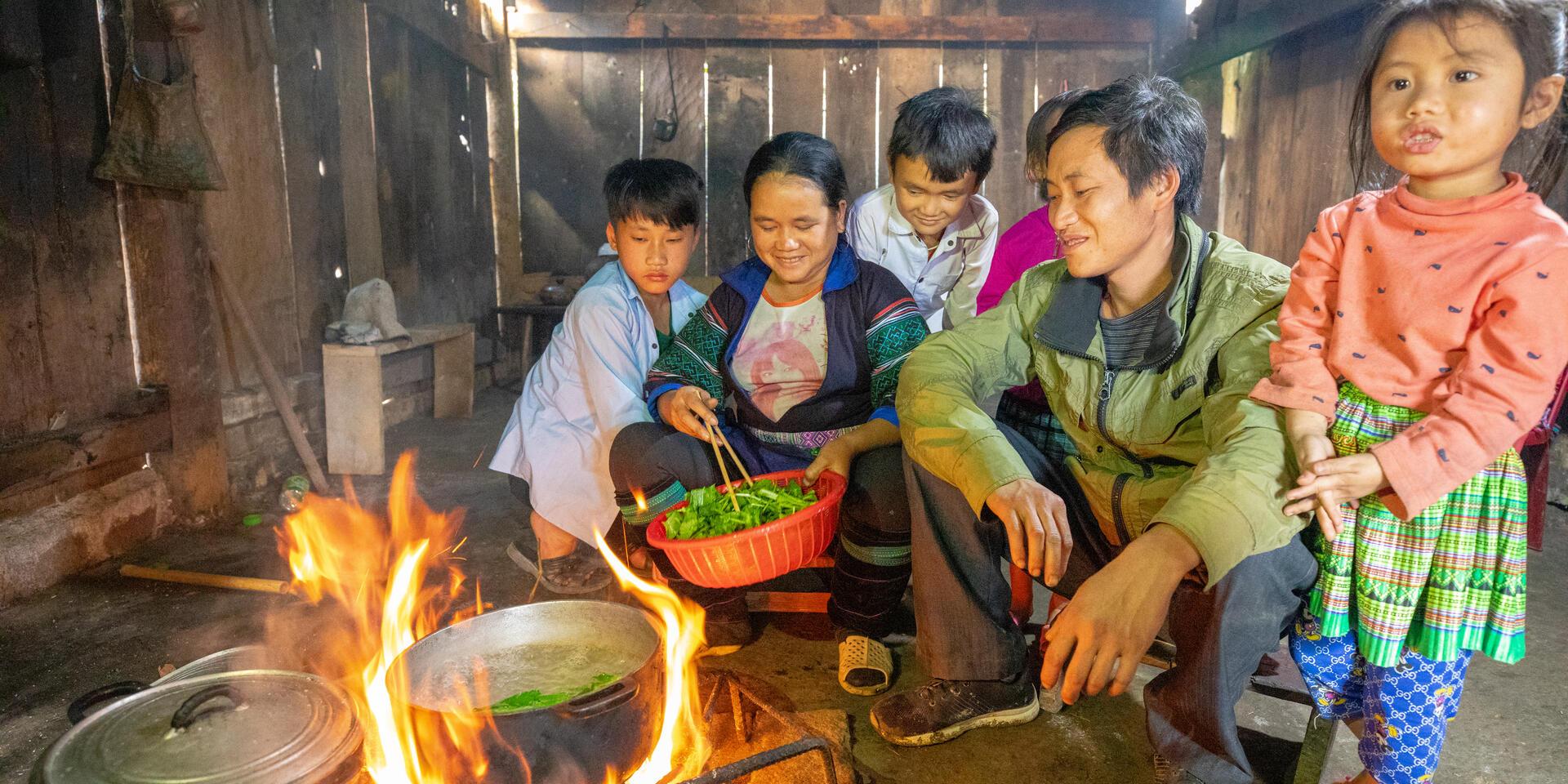 A Hmong family in their kitchen