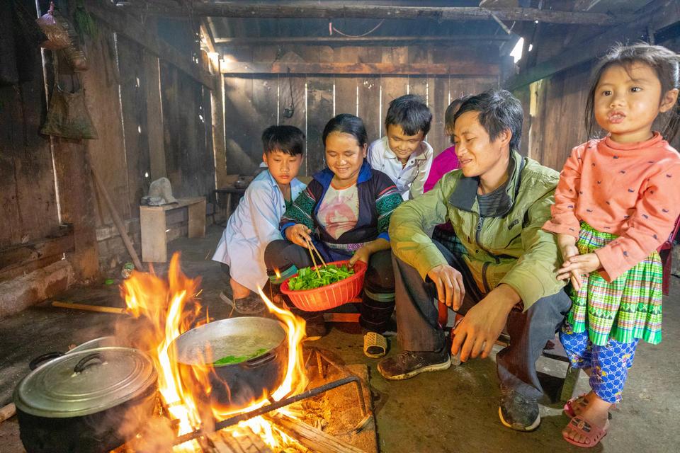 A Hmong family in their kitchen